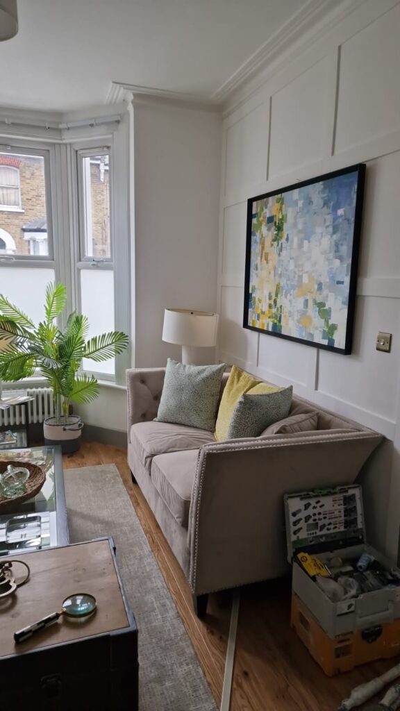 Living Room & Bedroom Renovation | London & Home Counties 2 A corner sofa with decorative cushions and a lamp in a well-lit room. - London
