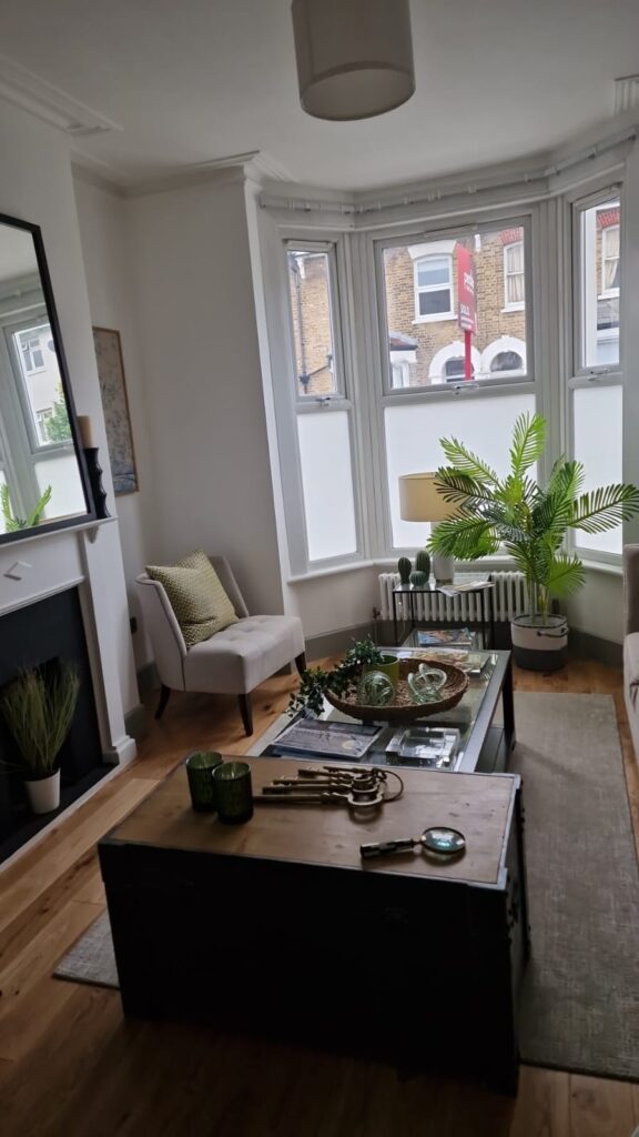 Living Room & Bedroom Renovation | London & Home Counties 4 A living room featuring a coffee table, chairs, and decorative plants in a bright space. - London