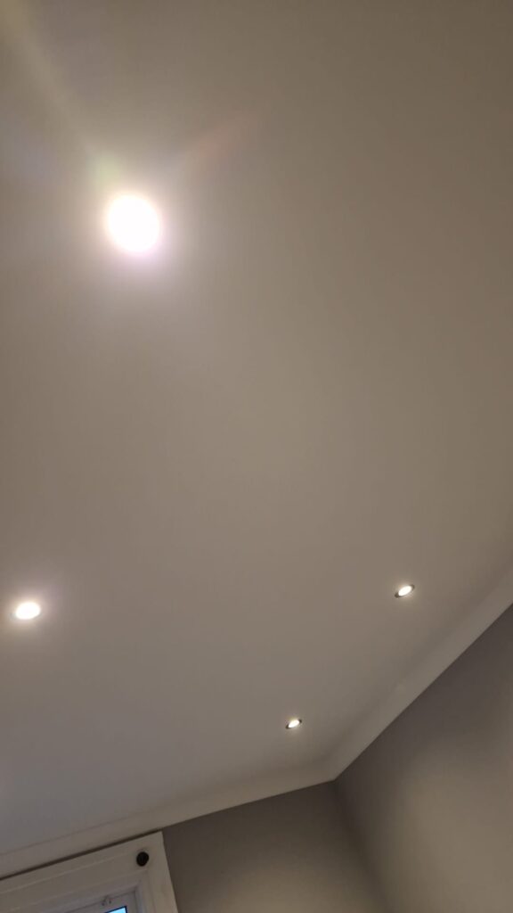 Living Room & Bedroom Renovation | London & Home Counties 18 Ceiling featuring multiple recessed lights in a neutral-toned room. - London
