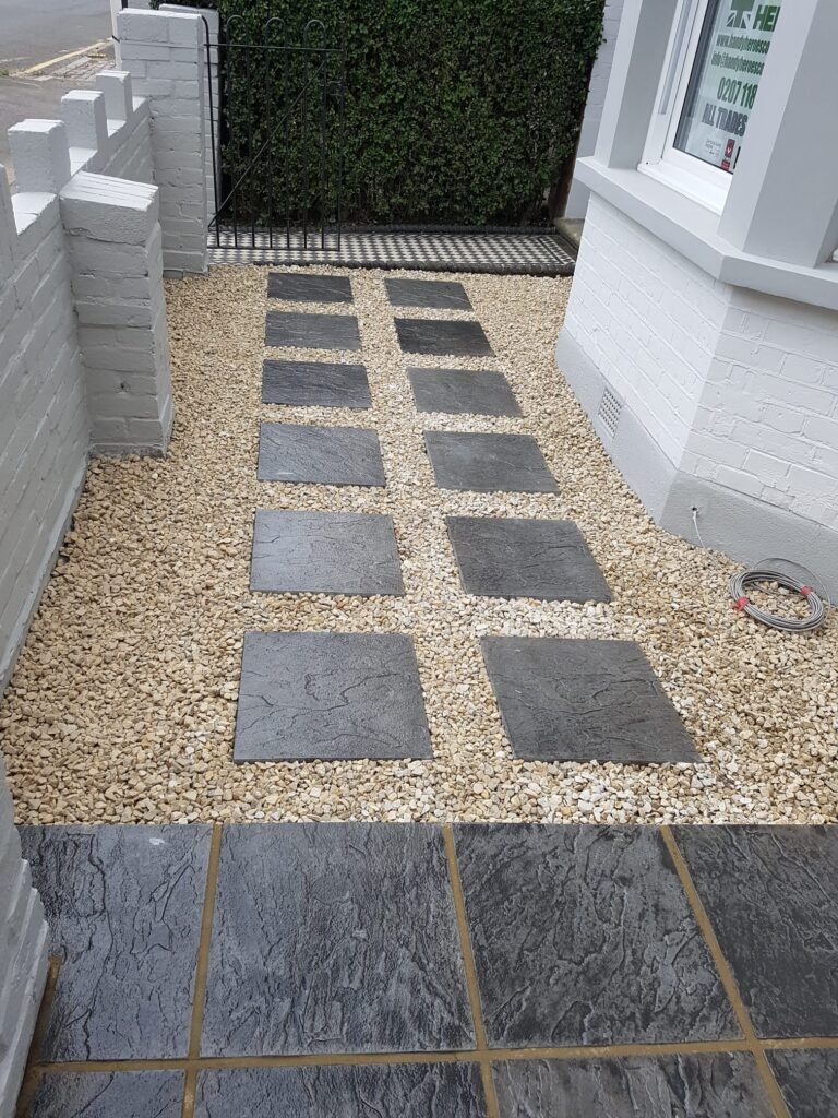 Garden Buildings & Outdoor Spaces | London & Home Counties 7 Pathway featuring rectangular stone slabs set in gravel, leading to a building entrance. - London