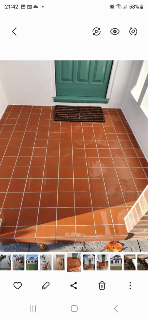 Garden Buildings & Outdoor Spaces | London & Home Counties 8 Terracotta tiles arranged in a grid pattern on an entrance floor with a green door above. - London