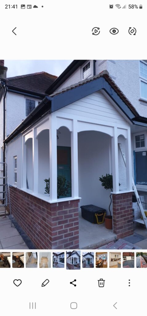 Garden Buildings & Outdoor Spaces | London & Home Counties 11 A newly constructed front porch featuring brick walls and white trim with plants on either side. - London