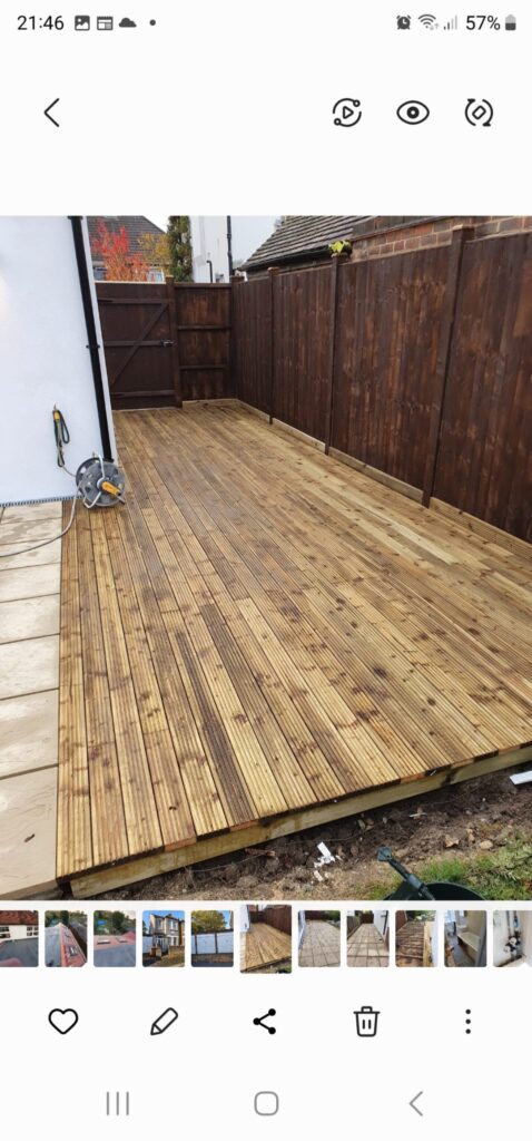 Garden Buildings & Outdoor Spaces | London & Home Counties 14 Wooden decking area with a smooth surface and timber fencing in the background. - London