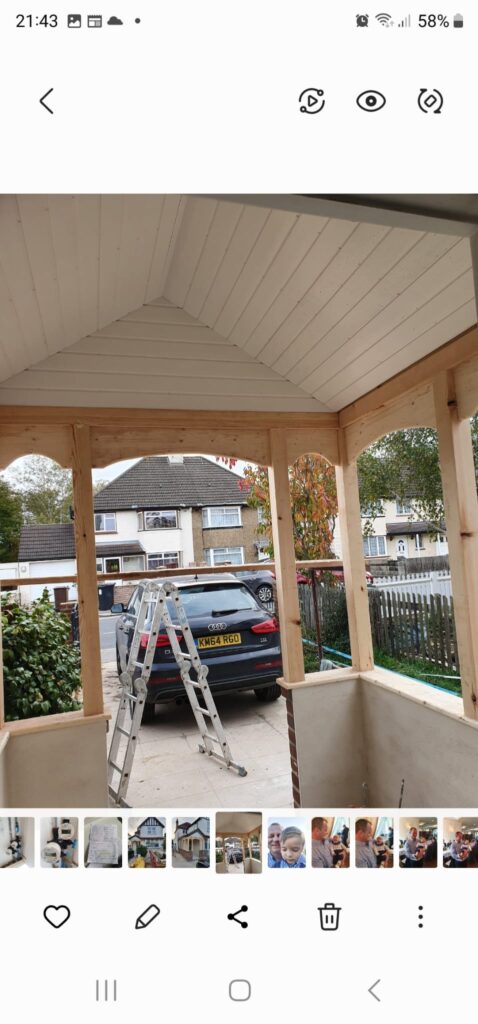 Garden Buildings & Outdoor Spaces | London & Home Counties 16 Wooden framework of a porch under construction with a ladder and parked car visible. - London