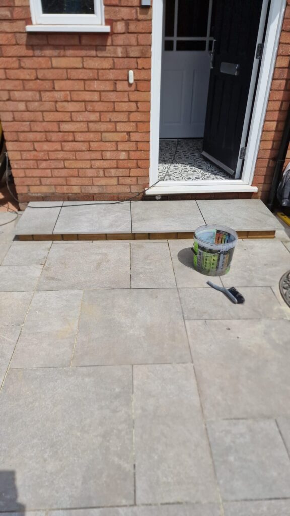 Garden Buildings & Outdoor Spaces | London & Home Counties 20 Paved entrance featuring steps leading to a door, with tools and materials nearby. - London