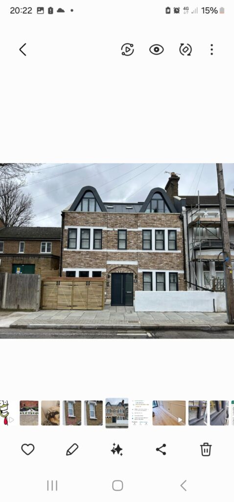 Garden Buildings & Outdoor Spaces | London & Home Counties 28 Three-storey residential building with a brick facade and modern roof design.